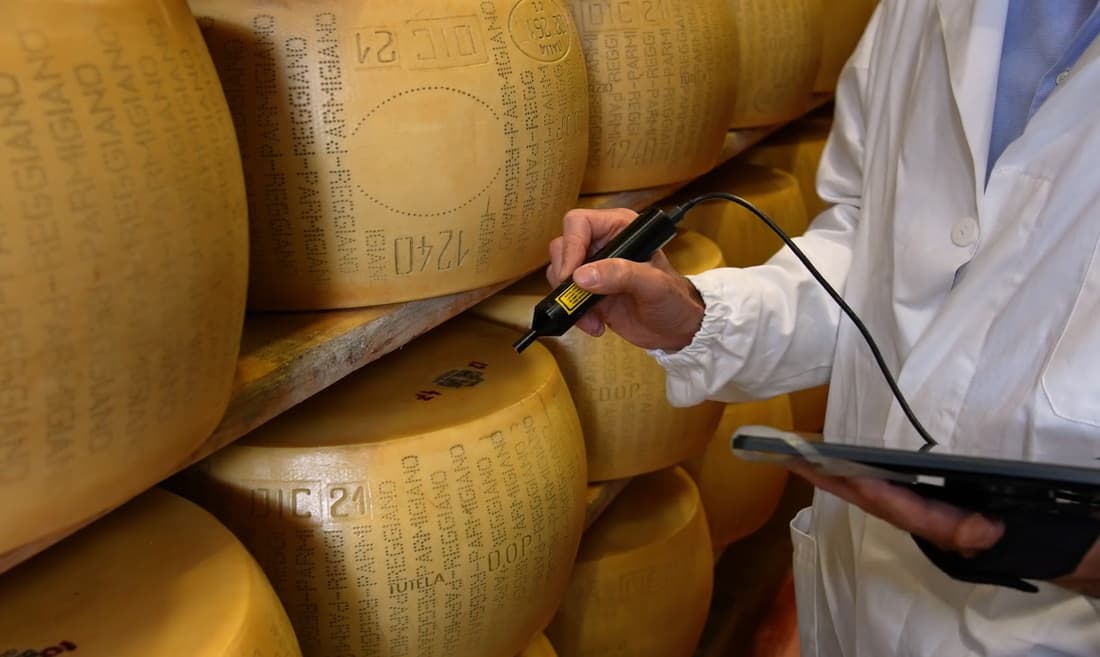 Italian cheese makers start chipping parmesan